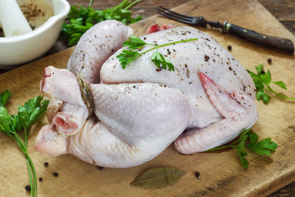 Here's Why You Should Have A Separate Cutting Board For Raw Chicken